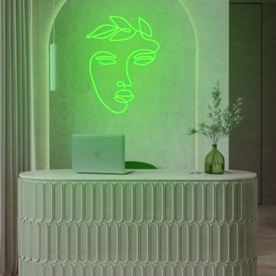 neon led twarz z liśćmi w salonie beauty